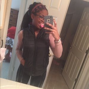 black quilted vest with red plaid lining